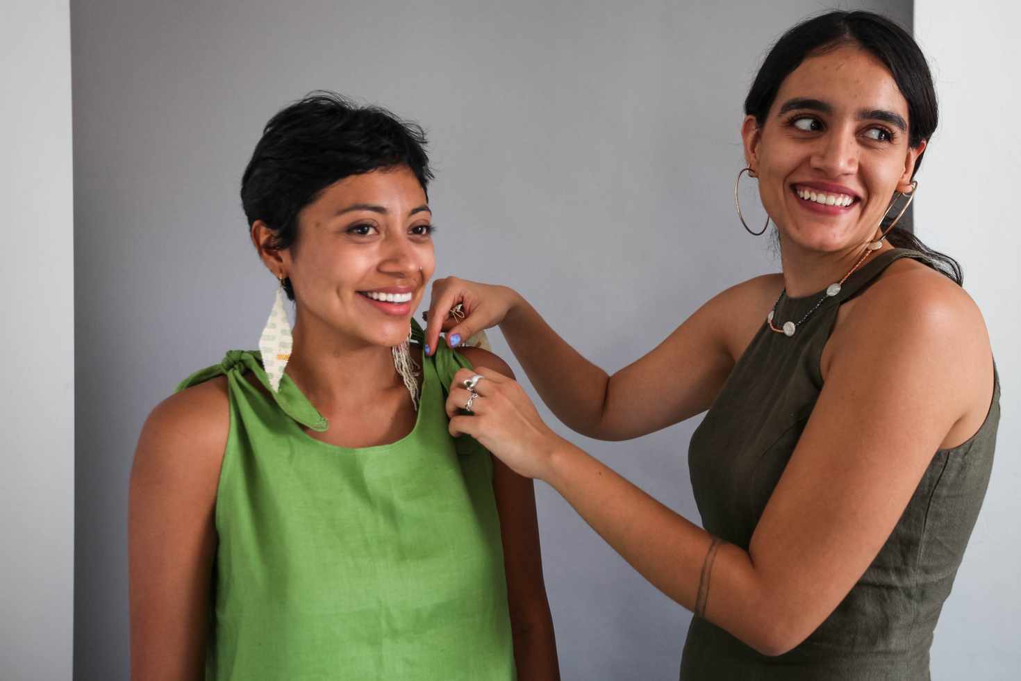 Smiling Women Wearing Sleeveless Clothes